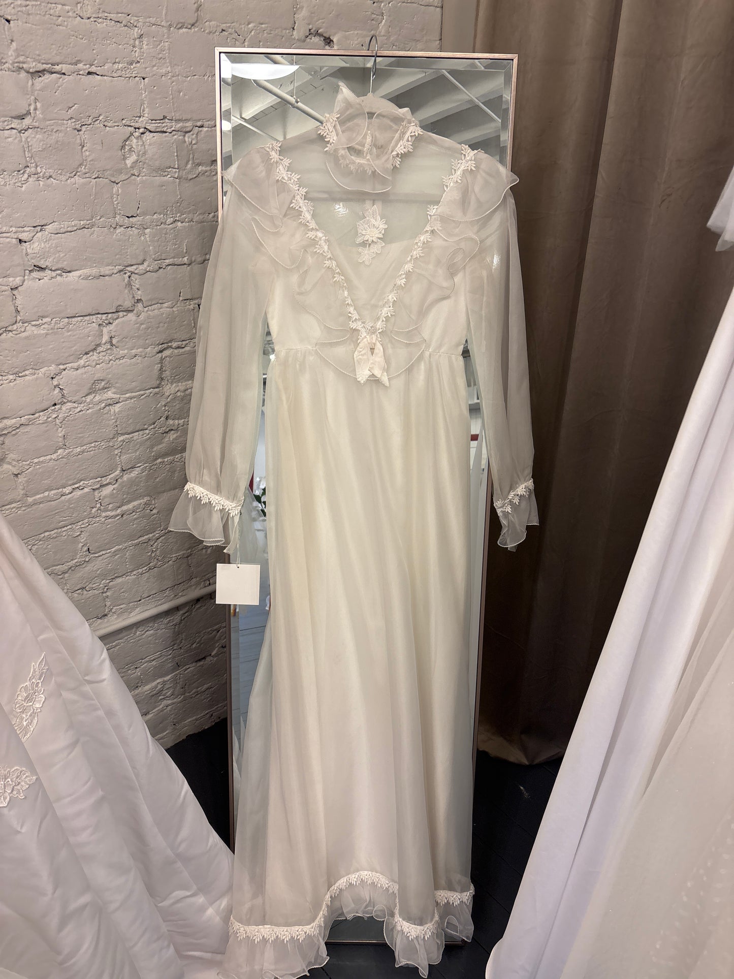 Kennedy: 1960s/70s, chiffon and satin, long sleeves, no train, ruffle collar and sleeves