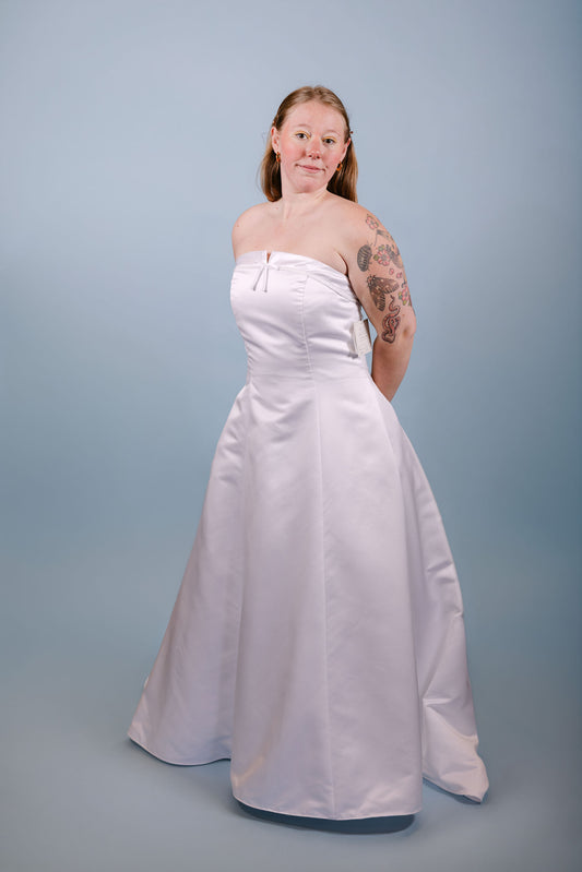 Paris: 2000s, white strapless with little beads and bow