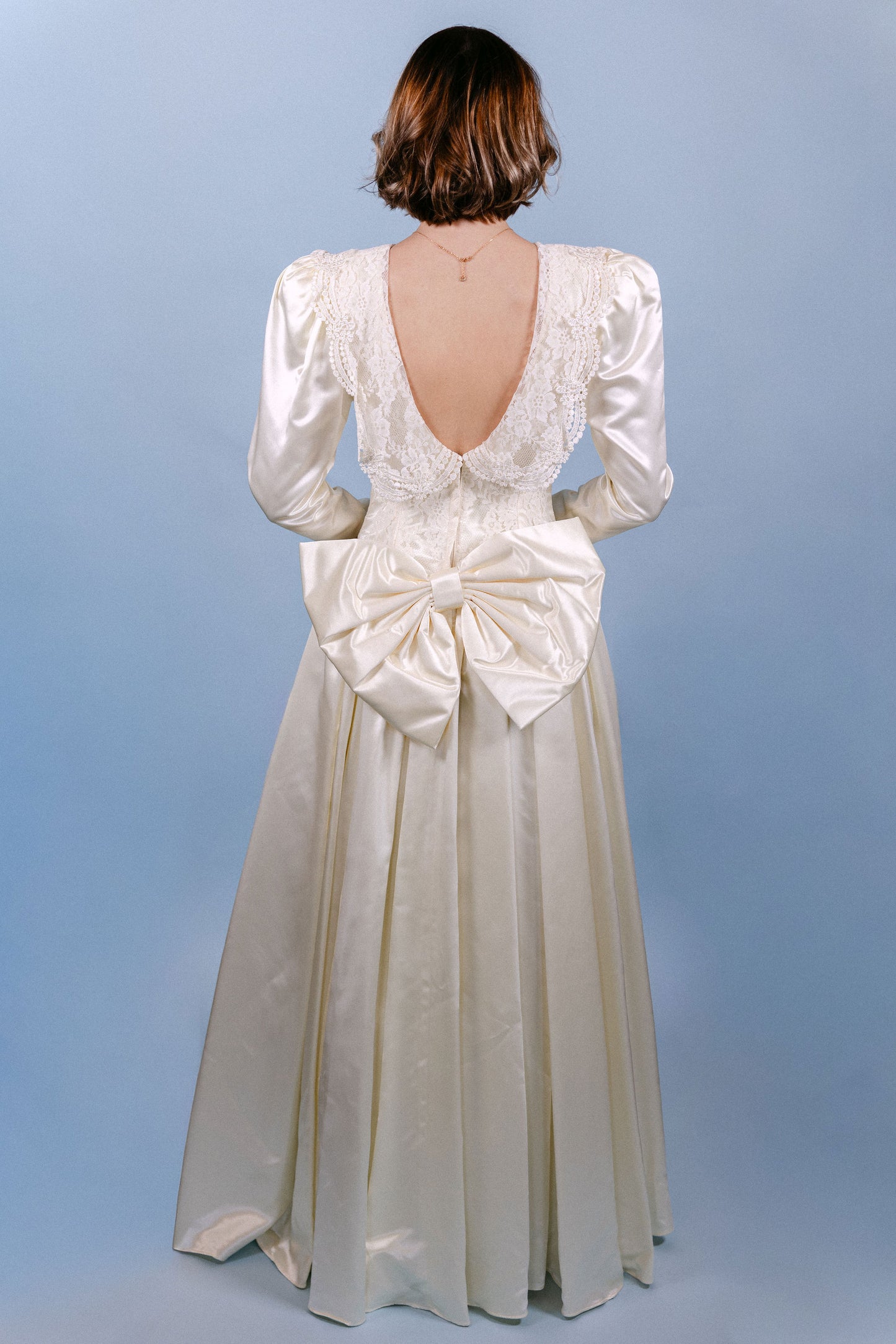 Rebecca: 1989, ivory, LS, big bow on butt, small train