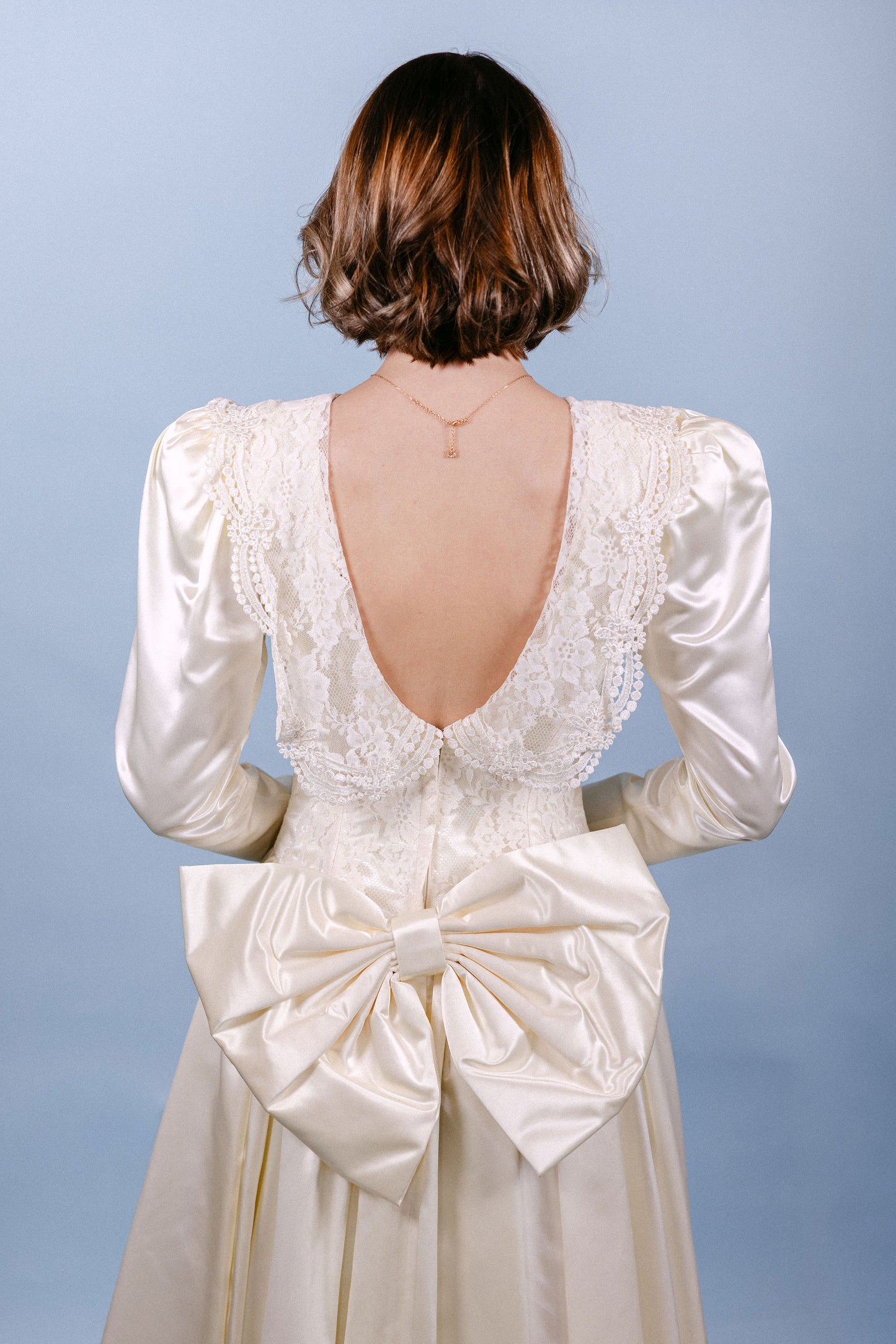 Rebecca: 1989, ivory, LS, big bow on butt, small train