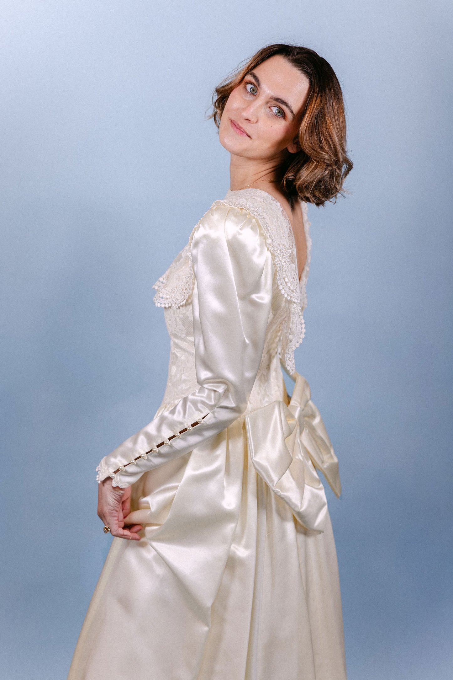 Rebecca: 1989, ivory, LS, big bow on butt, small train