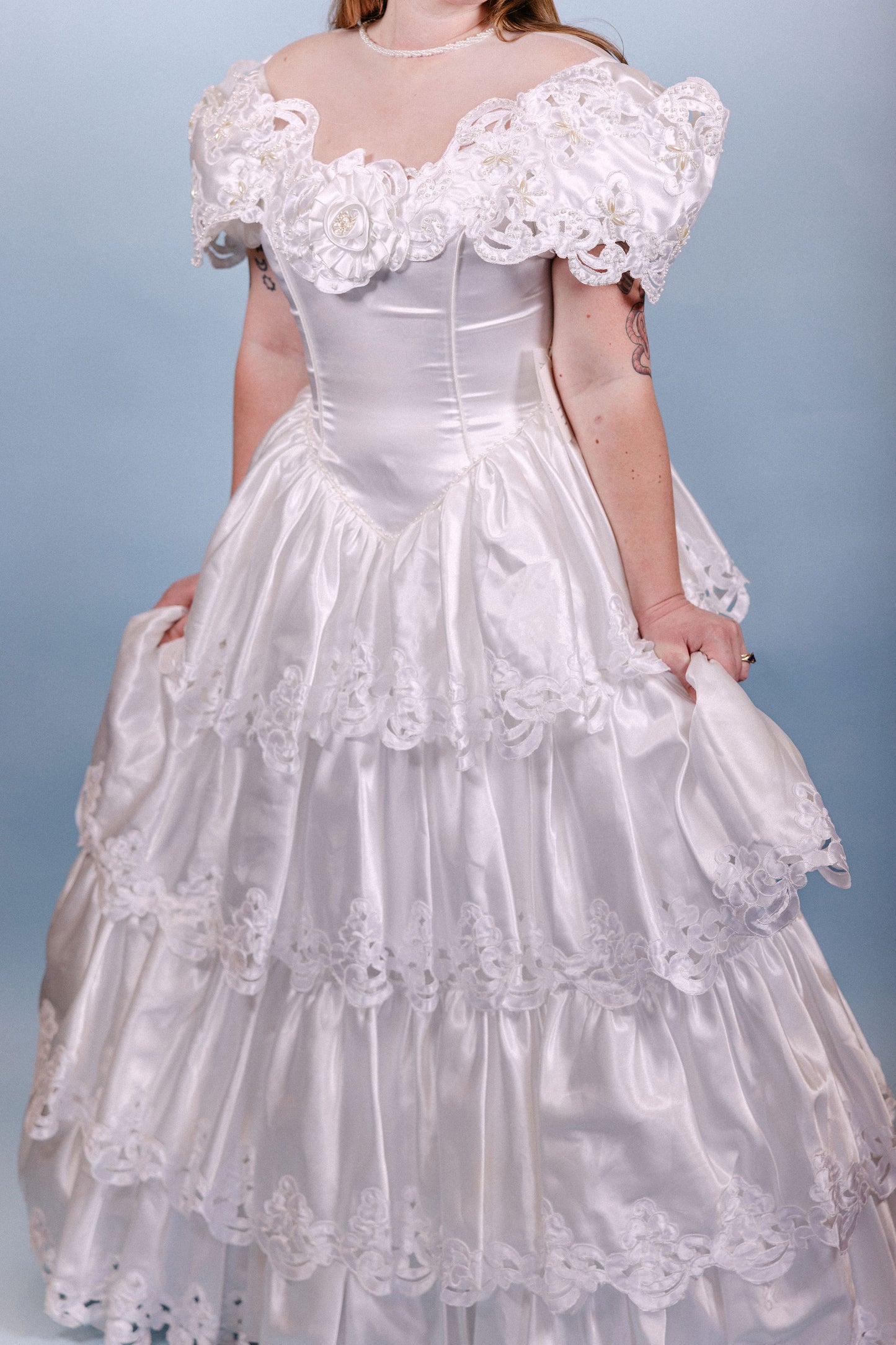 Brenda: 1980s, A-line with poofy tiers, and pearl/floral/sheer neckline