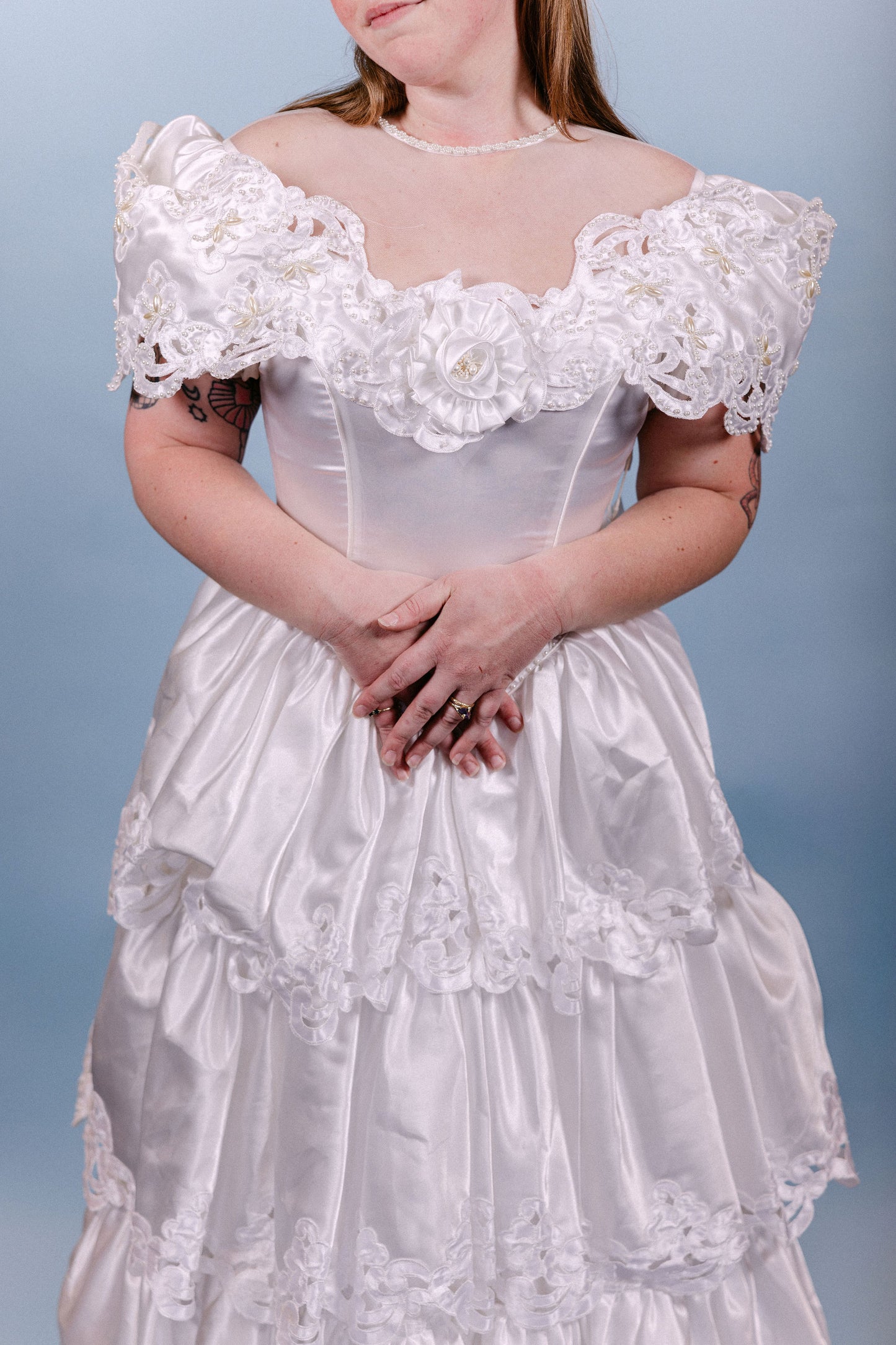 Brenda: 1980s, A-line with poofy tiers, and pearl/floral/sheer neckline