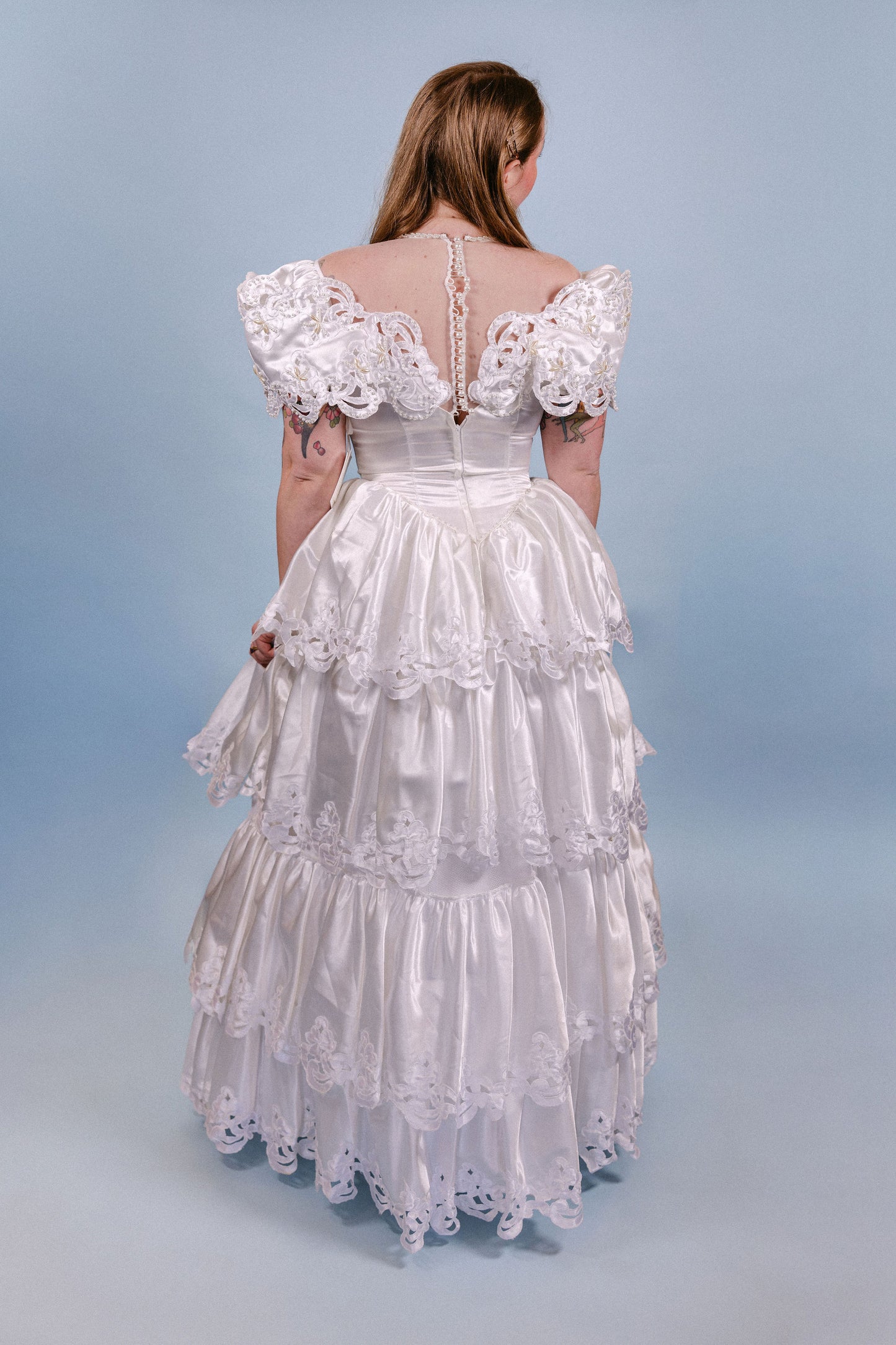 Brenda: 1980s, A-line with poofy tiers, and pearl/floral/sheer neckline