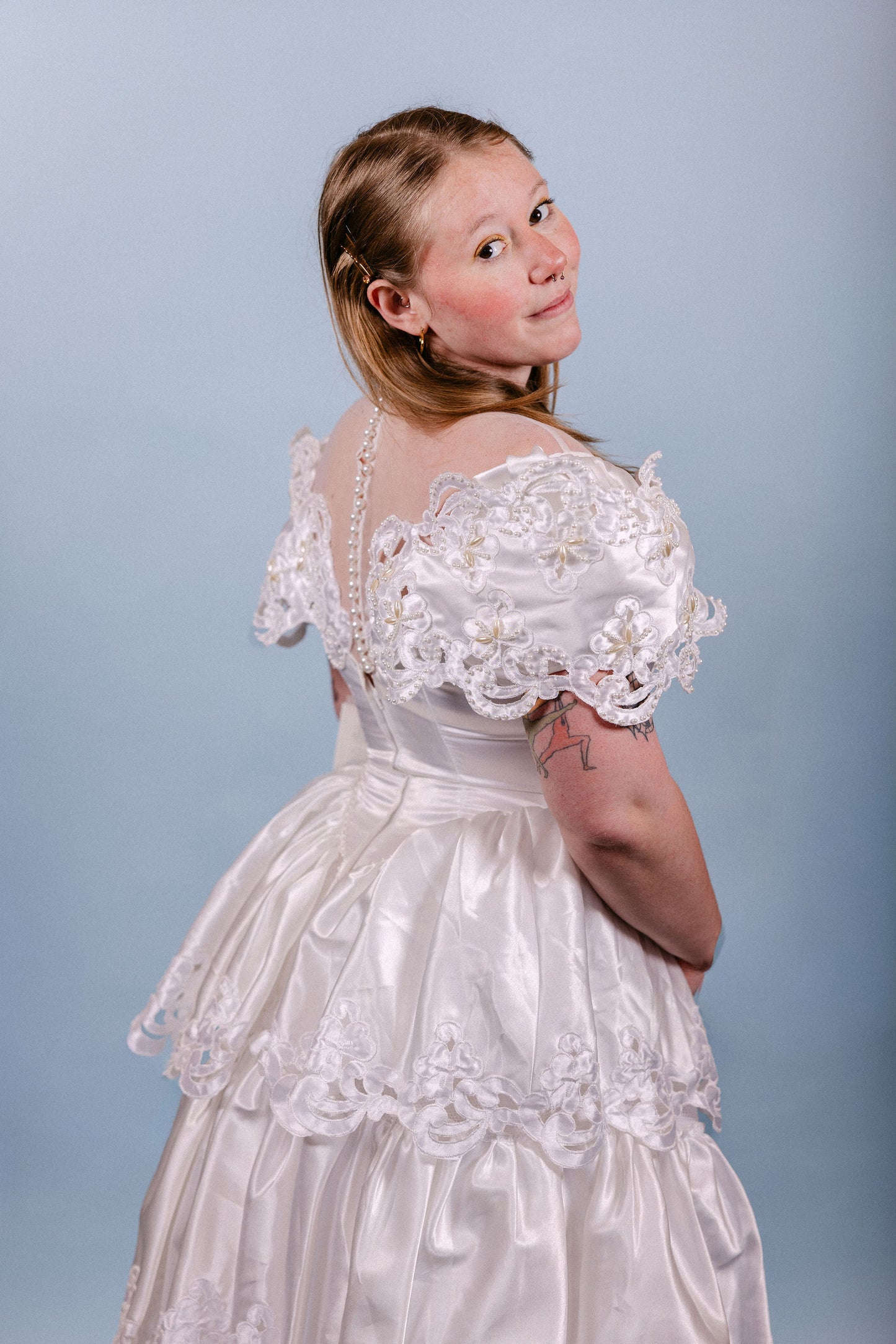 Brenda: 1980s, A-line with poofy tiers, and pearl/floral/sheer neckline