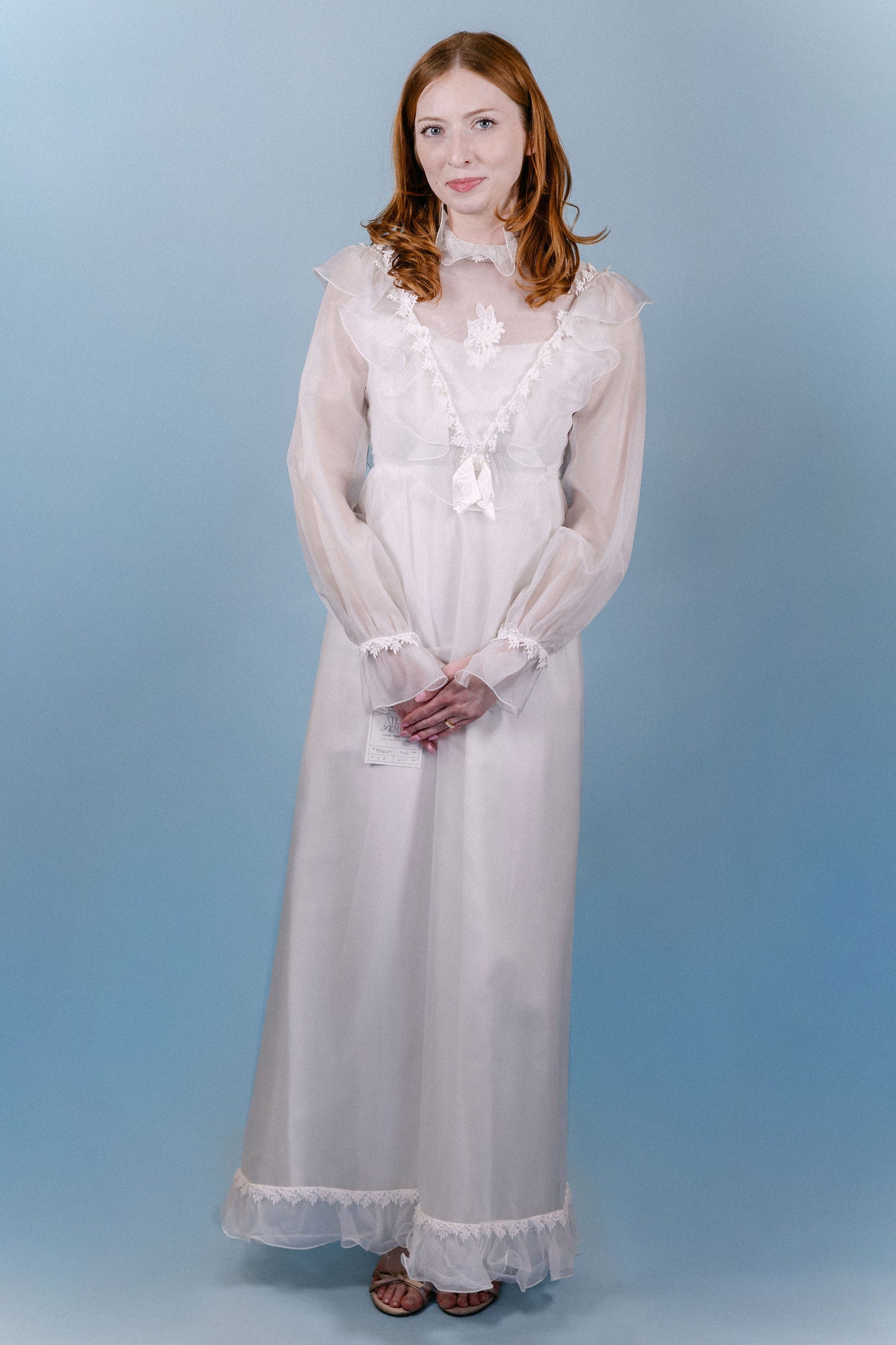 Kennedy: 1960s/70s, chiffon and satin, long sleeves, no train, ruffle collar and sleeves