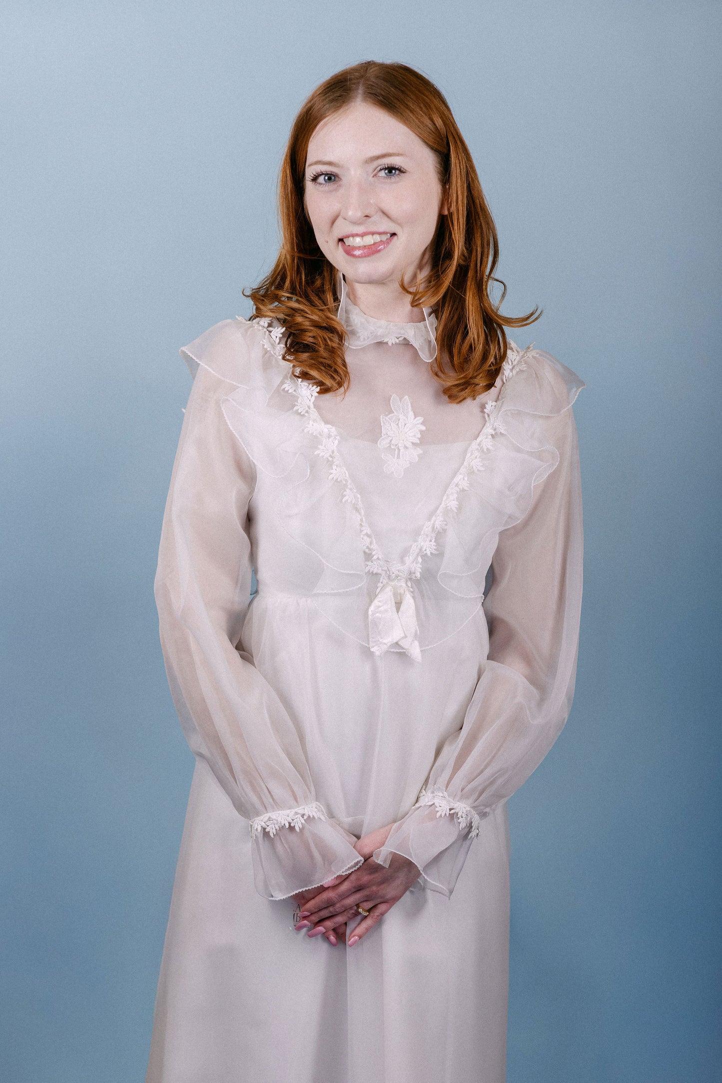 Kennedy: 1960s/70s, chiffon and satin, long sleeves, no train, ruffle collar and sleeves