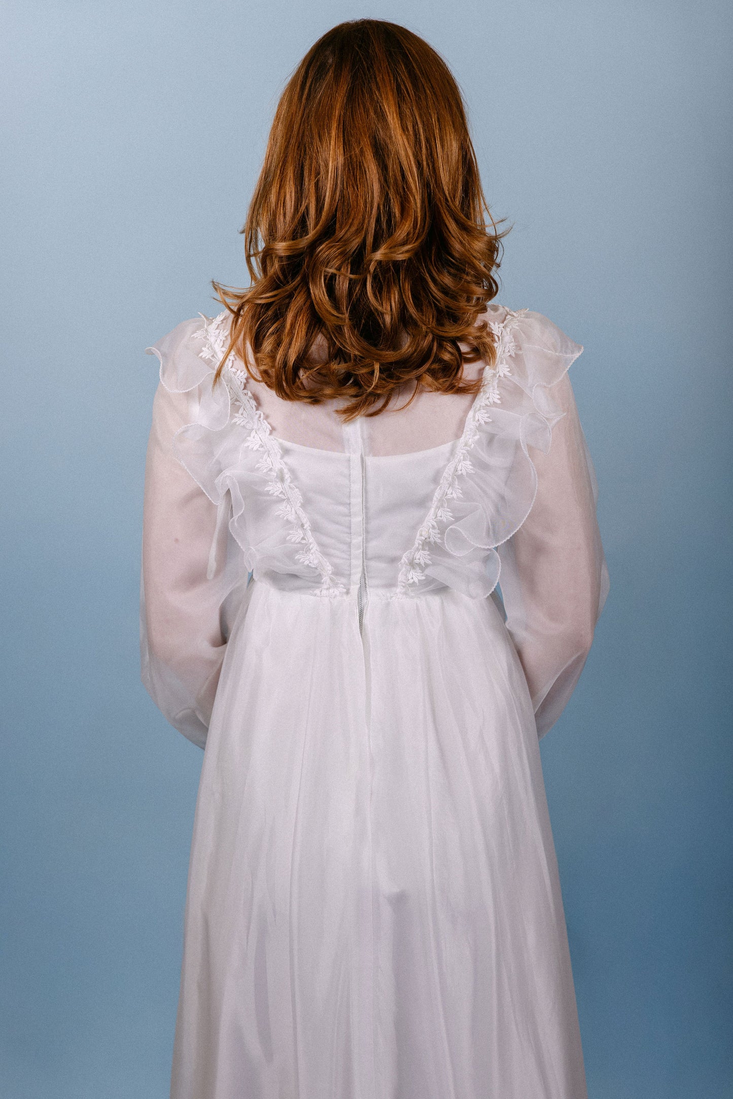 Kennedy: 1960s/70s, chiffon and satin, long sleeves, no train, ruffle collar and sleeves