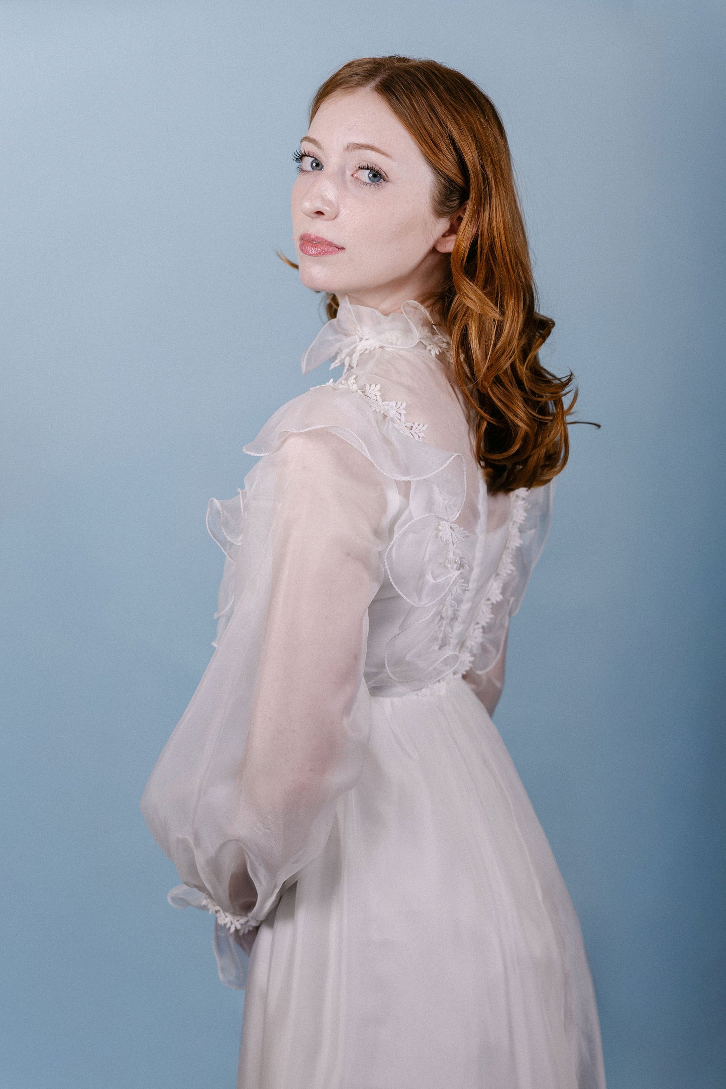 Kennedy: 1960s/70s, chiffon and satin, long sleeves, no train, ruffle collar and sleeves